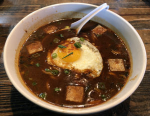 Deep, rich and dark, Diamond's big bowl of ramen gains salty umami flavor from miso and fried tofu. 