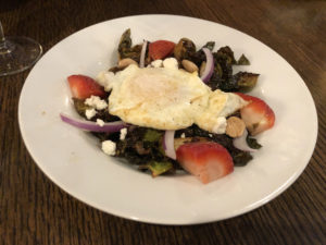 A fried egg, marcona almonds, and other good things elevate Fork & Barrel's fried brussels sprouts salad.