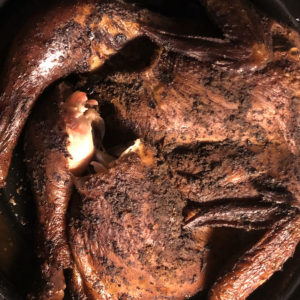 An aromatic dry rub of black pepper, garlic, and cumin make the smoked chicken at Galan's butcher shop a delight.