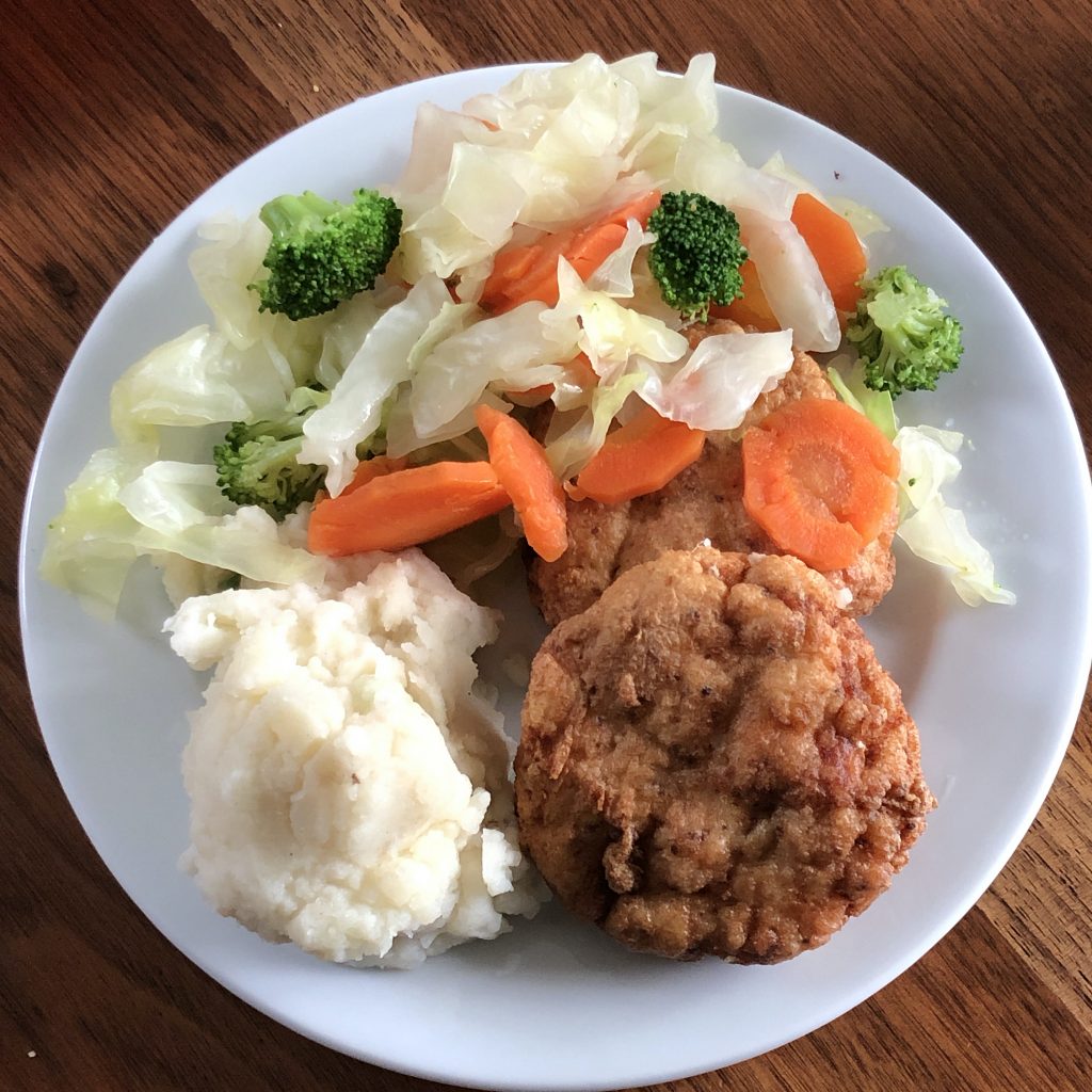 Shanagarry fish cakes at the Irish Rover are fashioned from a blend of smoked salmon and cod, served with veggies and mashed potatoes.