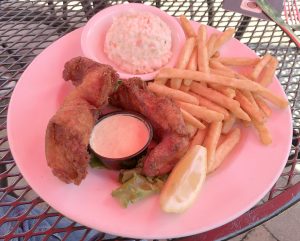 A sizable portion of beer-battered cod, fries and slaw make up Selena's popular fish and chips.