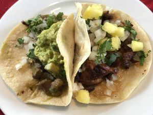 MexA's Norteño taco with beef and guacamole and a pork pastor and cheese taco with pineapple make a filling plate.