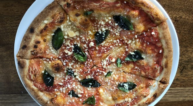 Bearing the red, white, and green colors of the Italian flag, bar Vetti's excellent Margherita pizza is a good rendition of the Neapolitan tradition.\