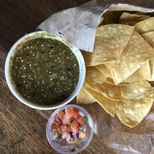 Crisp yellow-corn chips and fiery green tomatillo-jalapeño salsa from El Mundo Highlands.Crisp yellow-corn chips and fiery green tomatillo-jalapeño salsa from El Mundo Highlands.