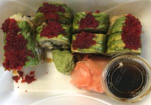 The dragon roll at ToGo Sushi places eel and cucumber within a roll topped with avocado and tobiko, flying fish roe.