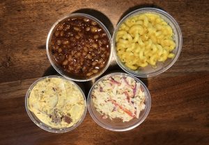 Four tasty vegan side dishes at Morels: Clockwise from upper right, smoked baked beans, mac & cheese, coleslaw, and loaded potato salad.