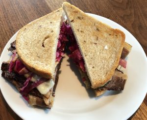 Gourmet Provisions' Piled High Pastrami really is piled high, nearly a pound of meat with pickled red cabbage and spicy brown mustard on seeded rye.