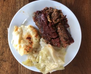 Tender, soft, and plenty of it, covered with a vinegary barbecue-style tomato sauce: That's Big Momma's meatloaf. We took mashed potatoes and cabbage on the side.