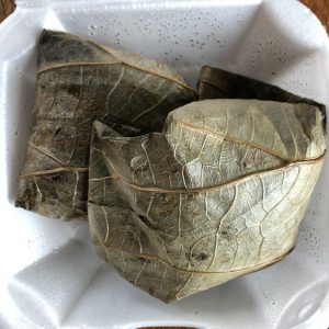 Oversize lotus leaves are wrapped around sweet rice studded with bits of pork, chicken, and shrimp.