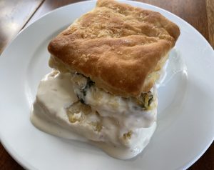 The sunshine biscuit box at Boujie biscuit places a tasty tomato-and-spinach frittata on a biscuit.