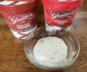 A scoop of Graeter's cinnamon ice cream and pints of cinnamon and peppermint stick.