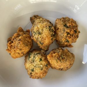 Shreeji's daal vada are ping-pong size balls of fiery deep-fried lentil dough studded with herbs and spices.