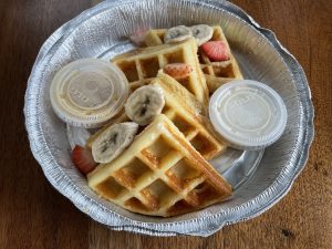 A dusting of cinnamon sugar turns the churro waffle at Con Huevos into a Mexican-style dessert for brunch.