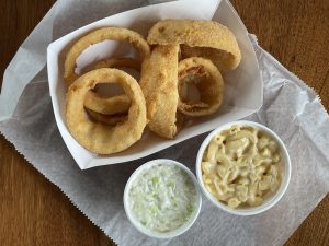 Thick-cut, thickly breaded onion rings, fresh cole slaw and simple, creamy mac-and-cheese are popular side dishes at the Fishery.