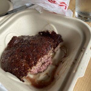 We ordered a single grass-fed local beef patty to go, but couldn't resist cutting into it on the spot to enjoy its pink and juicy medium-rare interior.