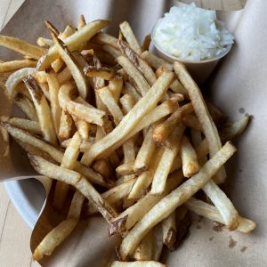 Monnik's french fries are crisp and hot, never better than eaten right out of the kitchen. The war fries option comes with a tub full of peanut sauce, chopped onion, and house mayo to stir right in.