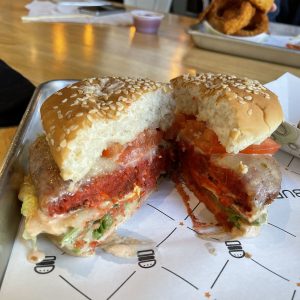 Here's a peek at the six layers of goodness inside BurgerIM's aloo tikki burger.