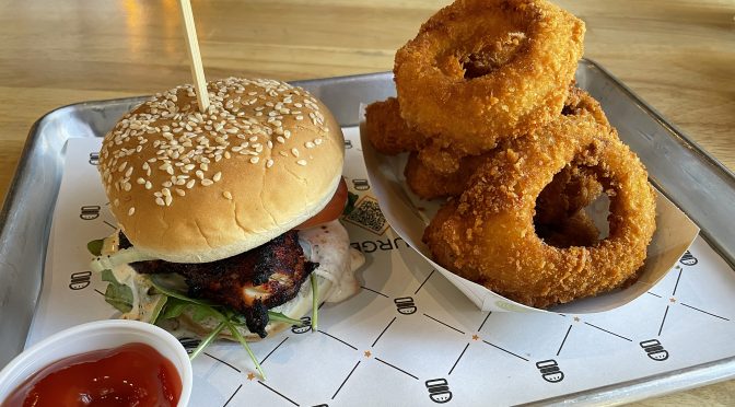 BurgerIM's new chili chicken burger is actually a whole piece of roasted boneless chicken loaded with fiery Indian spices.