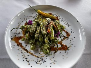 Blistered shishito peppers are a frequent appetizer special at Seviche. When you're on the menu, you'll want to try these mild, subtly flavored grilled peppers with their soy-lime glaze.