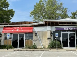 The roof that collapsed almost two years ago and forced four popular restaurants to close remains upended into the space once occupied by Half Peach and Charim.
