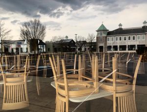 At the end of March 2020, with the pandemic lockdown in full force, chairs stood on tables within Wild Eggs' locked doors; its windows reflected an empty Westport Village parking lot.