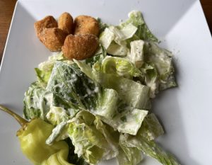 The caesar salad – a smaller side salad shown here – ticks all the boxes for this salad classic.