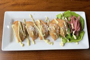 Veggie empanadas at Faces make a great starter with their deep-fried, umami-rich goodness.