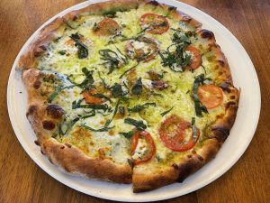 Noosh Nosh's take on the classic margherita pizza departs a bit from tradition, but it's cheesy and appealing.