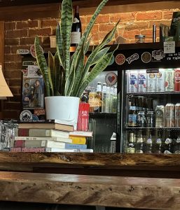 Nothing signals Pints & Union's hospitality more than a random stack of books handy for you to pick up and read if you'd rather enjoy your drink quietly alone.