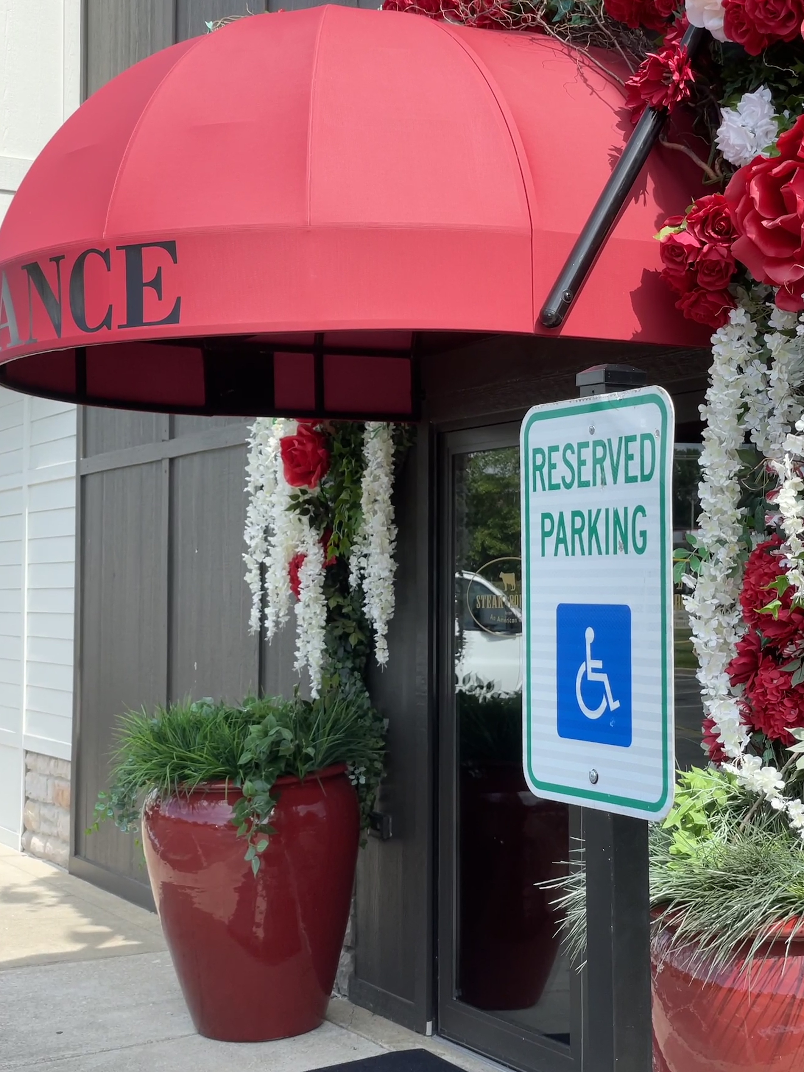Steak & Bourbon in Westport Village demonstrates easy access, with reserved parking spaces for disabled drivers located adjacent to the accessible main entrance.