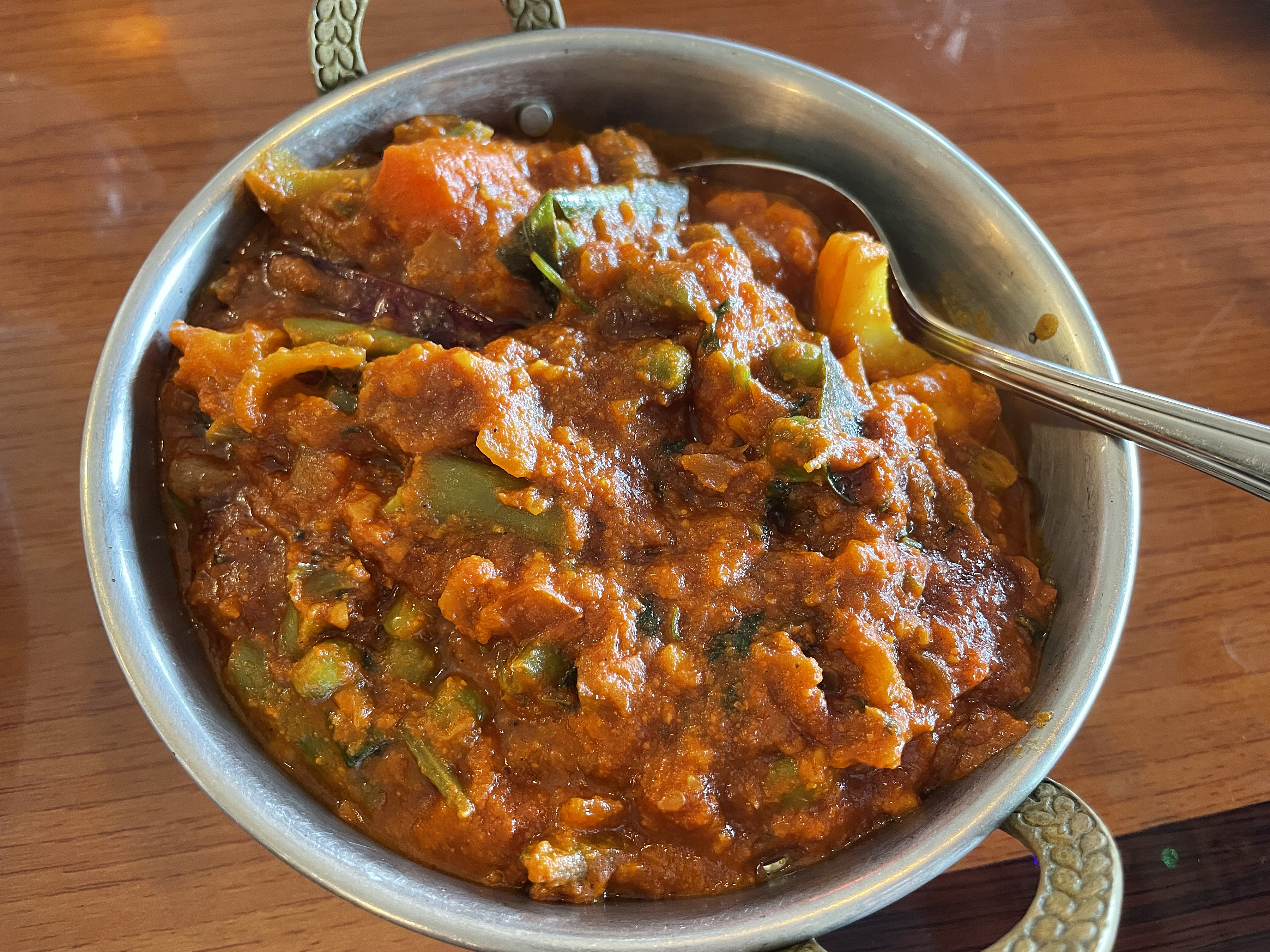 A produce shop full of veggies swim in thick, fiery gravy in vegetable Igguru, a curry with roots in Andhra on the Bay of Bengal.