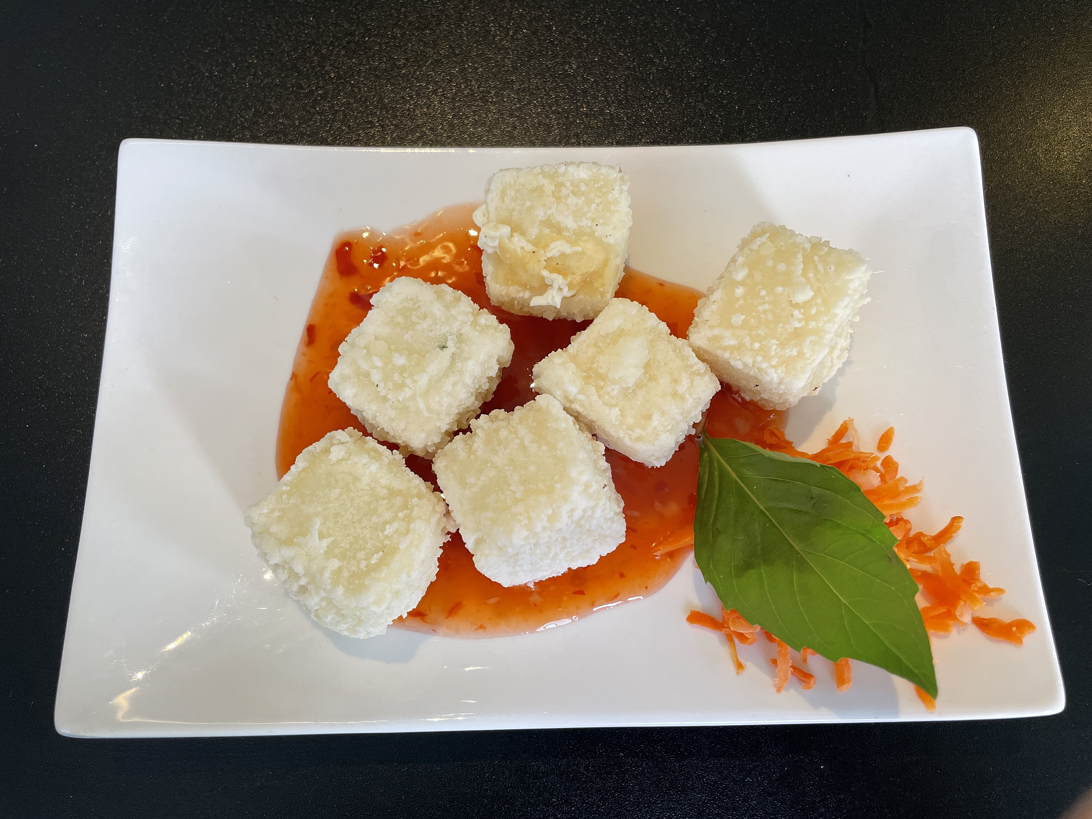 How do they keep deep-fried cubes of shattering crisp tofu so pure white? The server wouldn't give up the secret.