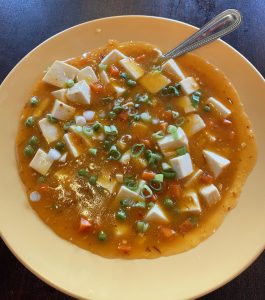 Ma Po tofu, a classic dish of Chengdu in Sichuan, China, that has gone worldwide, gets the authentic treatment here with an appealing mix of hot chile peppers and numbing SIchuan pepper adding fire.