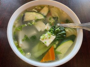 Veggie tofu soup was a triumph of simplicity, aromatic and clear, built on a broth that signals a skilled chef at work.