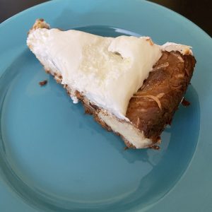 A generous slice of coconut pie was creamy and rich, with a dollop of whipped cream to top it off.