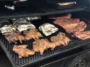 The smoker at Galan's butcher shop is loaded down with chickens, racks of ribs, and shredded spicy beef.