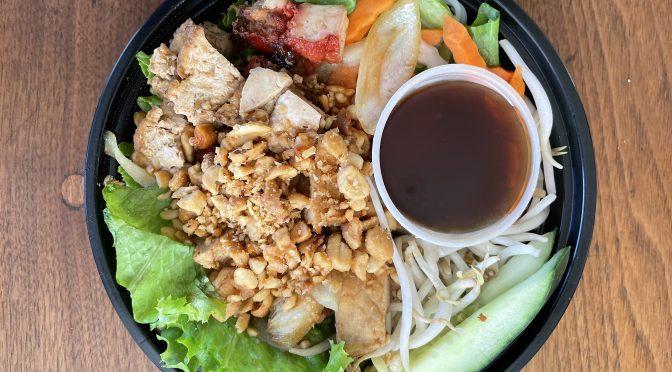 Vietnamese rice-noodle salad is chock full of peanuts and flavored tofu bites, with fresh lettuce, carrot slices, and plenty of tender rice noodles underneath.