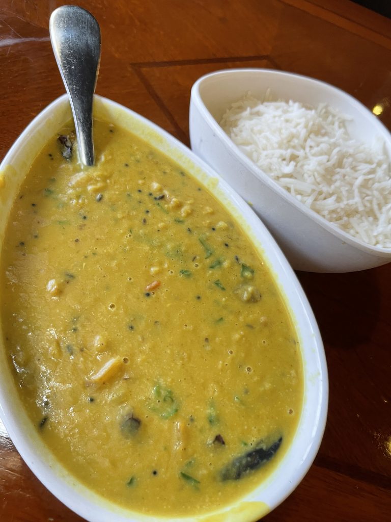 Coconut milk and curry flavors bring a delicious whack of aromatics to this bright-yellow, turmeric-shaded lentil daal.