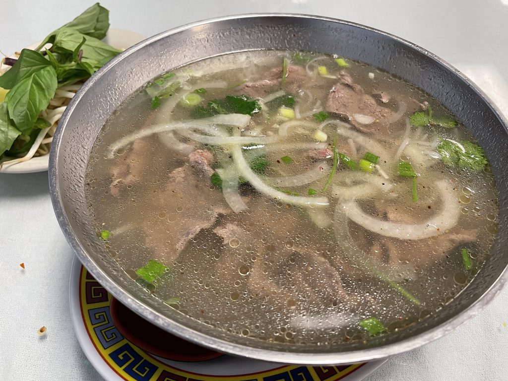 Pho, the classic Vietnamese soup-as-dinner, somes in six varieties here. This basic pho, tender thin-sliced beef in a rich, savory broth, is as good as it gets.