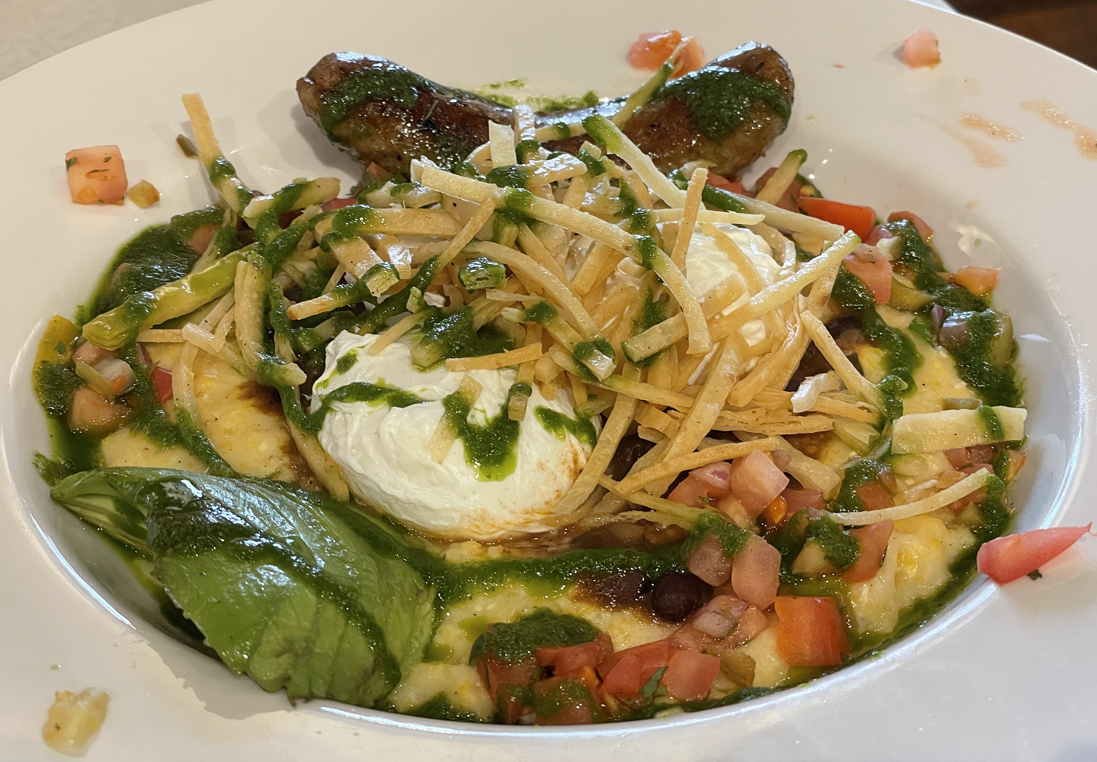 The huevos rancheros grit bowl brings South of the Border flavors to the table with pico de gallo, black beans and tortillas to accompany poached eggs and cheese grits.