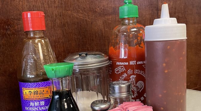 Like most Vietnamese restaurants, Vietnam Kitchen keeps a handy tray of condiments on every table, including Sriracha and Asian chile sauce with garlic.