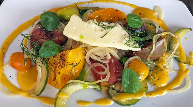 A perfect local heirloom tomato and charred cucumber salad at Harvest.