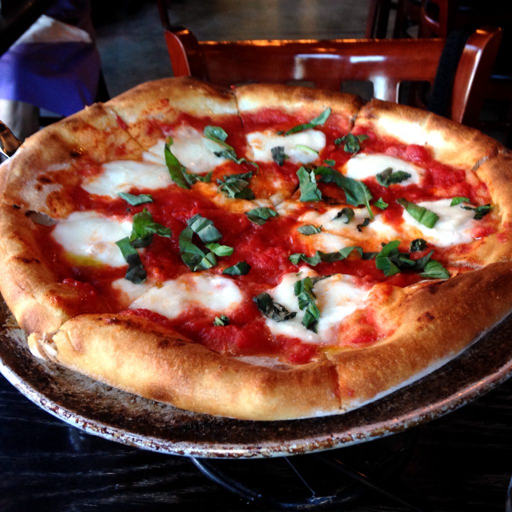 Boldly flying the red, green, and white colors of the Italian flag, the St. Matthew's – Coals Artisan Pizza's version of the pizza Margherita is outstanding, and its simple toppings keep nutrition under control.