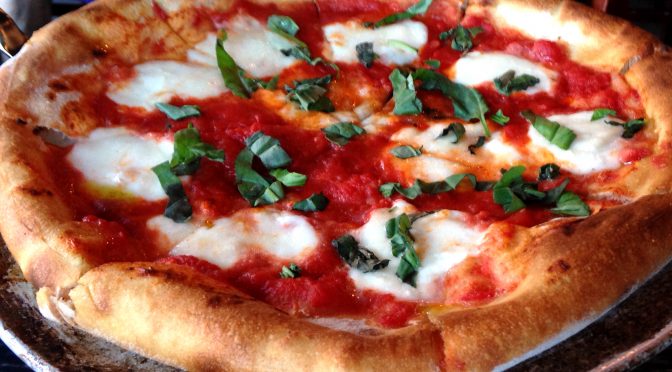 Boldly flying the red, green, and white colors of the Italian flag, the St. Matthew's – Coals Artisan Pizza's version of the pizza Margherita is outstanding, and its simple toppings keep nutrition under control.