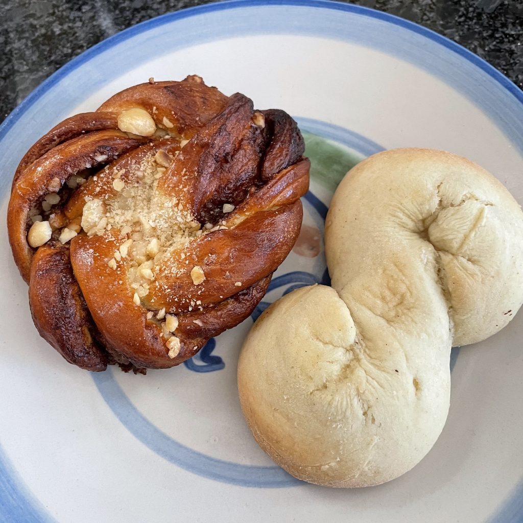 Two tasty Scandinavian pastries from Smør: A chocolate-hazelnut cardamom pastry, akin to a Danish (left) and a light-as-air, almond-scented kringla cookie.