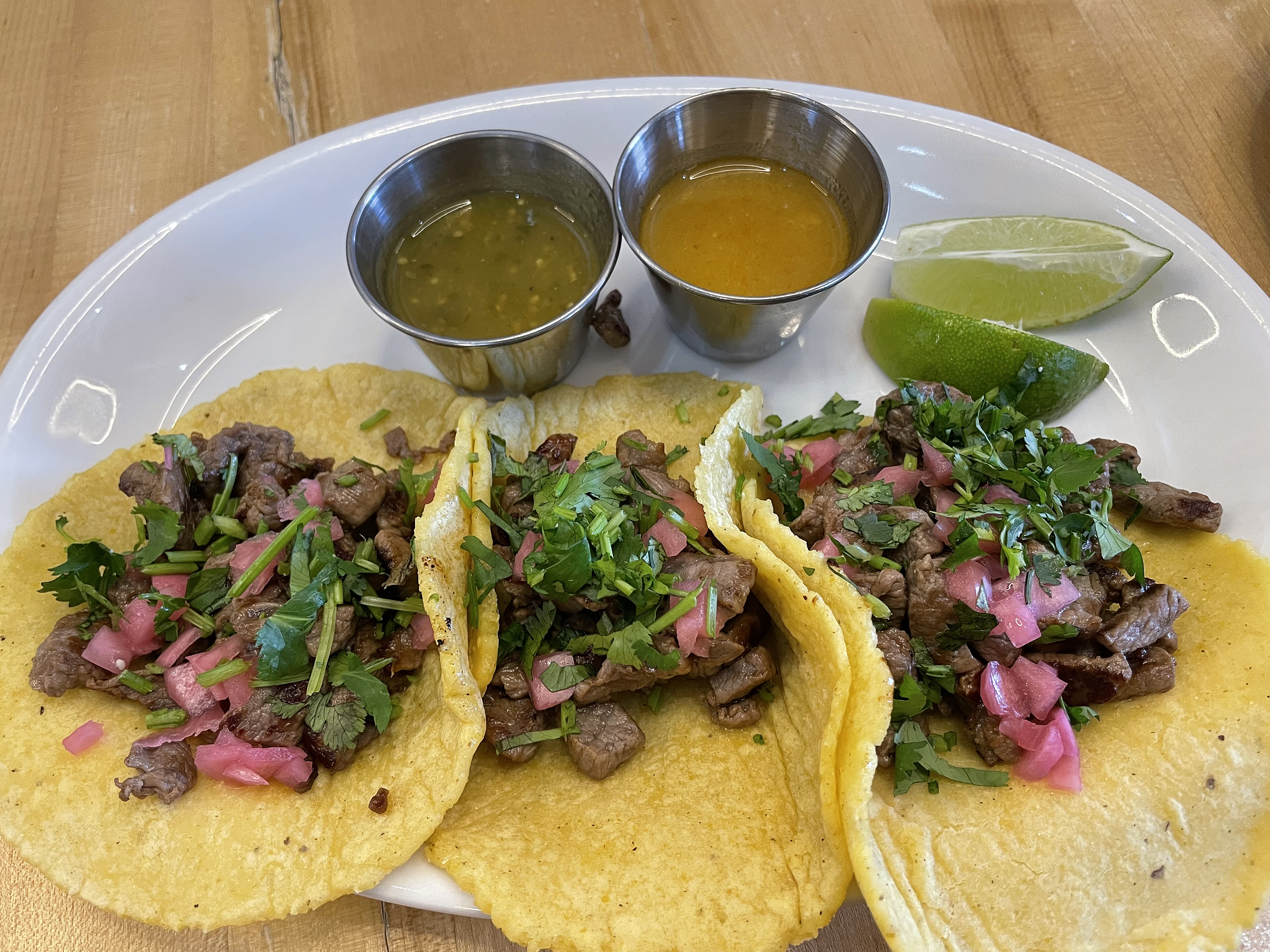 Lunch dishes at Con Huevos are worthy too, like these three grilled beef carne asada tacos made on a base of thick fresh corn tortillas.