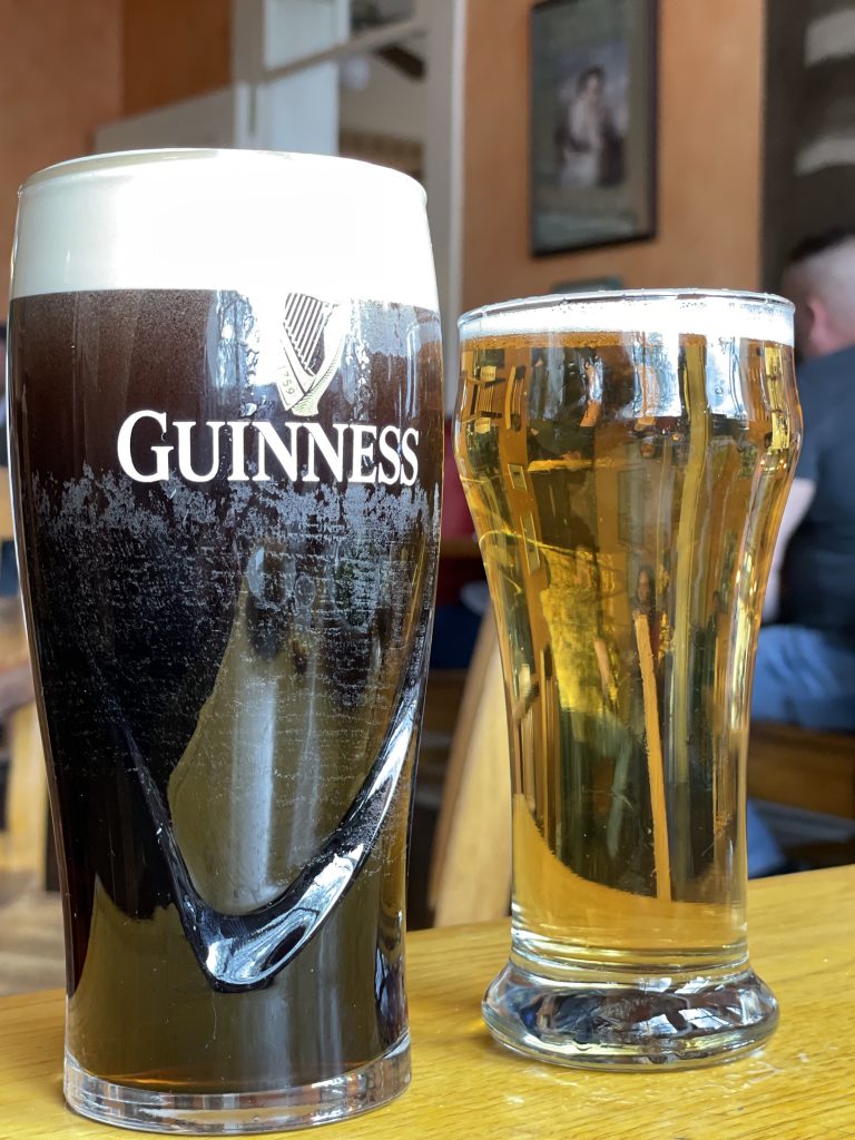 I can't visit Irish Rover without enjoying a dark, tall pint of freshly drawn Guinness, shown with a half-pint of Guinness's light but hoppy Harp lager.