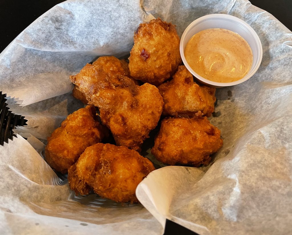 What's not to like about sizzling corn fritters, cloaked in crunchy breading and fried golden-brown?