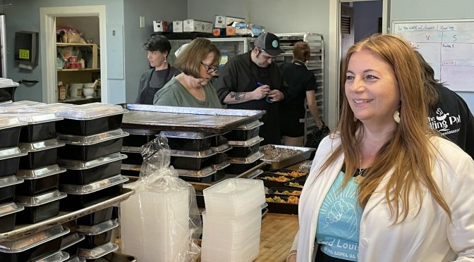 Feed Louisville's executive director and co-founder Rhona Bowles Kamar oversees a very active morning at work in Feed Louisville's kitchen at Douglass Boulevard Christian Church.