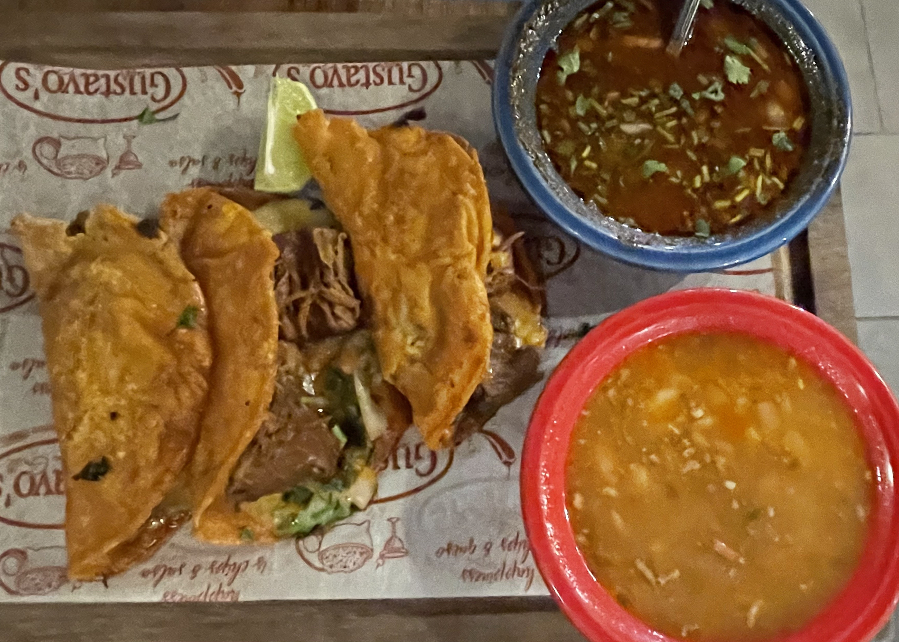Birria is like a turbo-powered taco. Gustavo's tasty version is made with long-marinated and simmered Angus beef, chiles, and spices packed into marinated crisp corn tortillas to maximize its flavor.